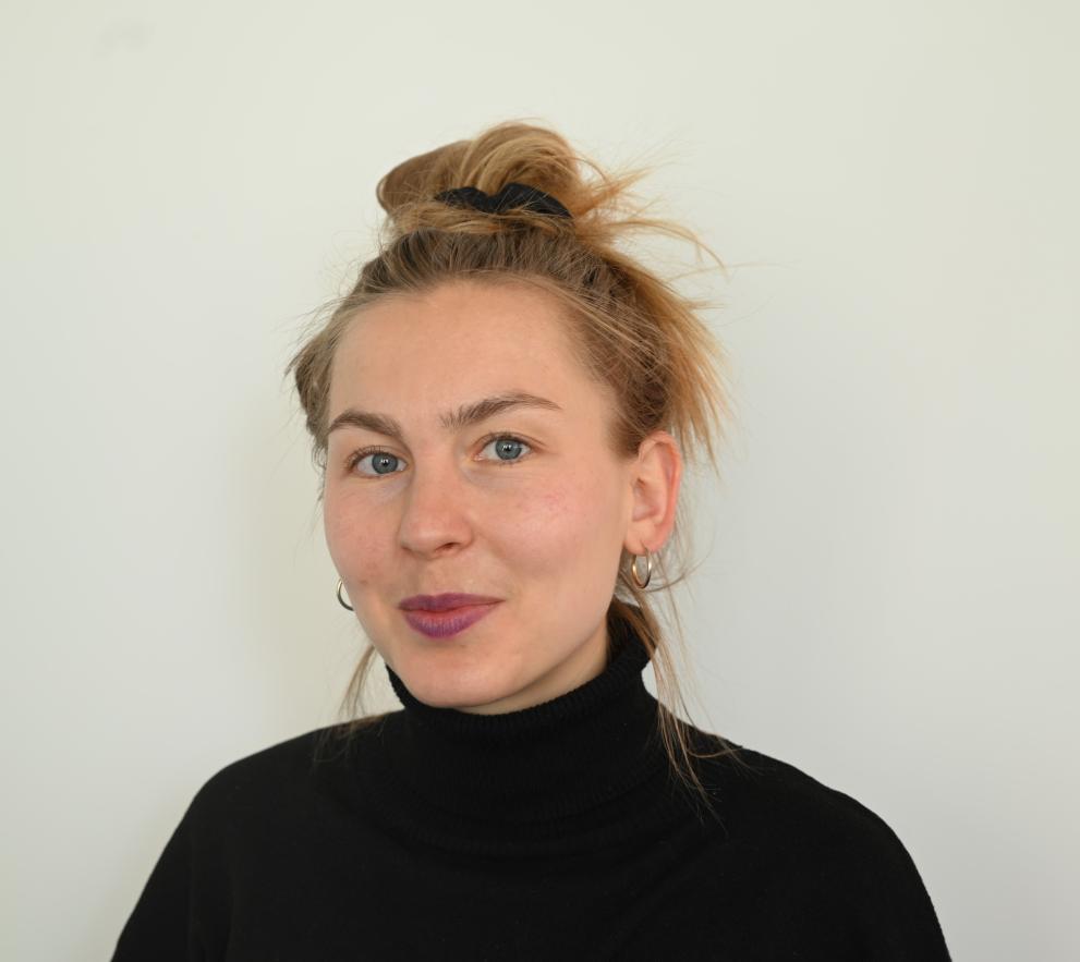 Esther Breffka wearing a black turtle neck. 