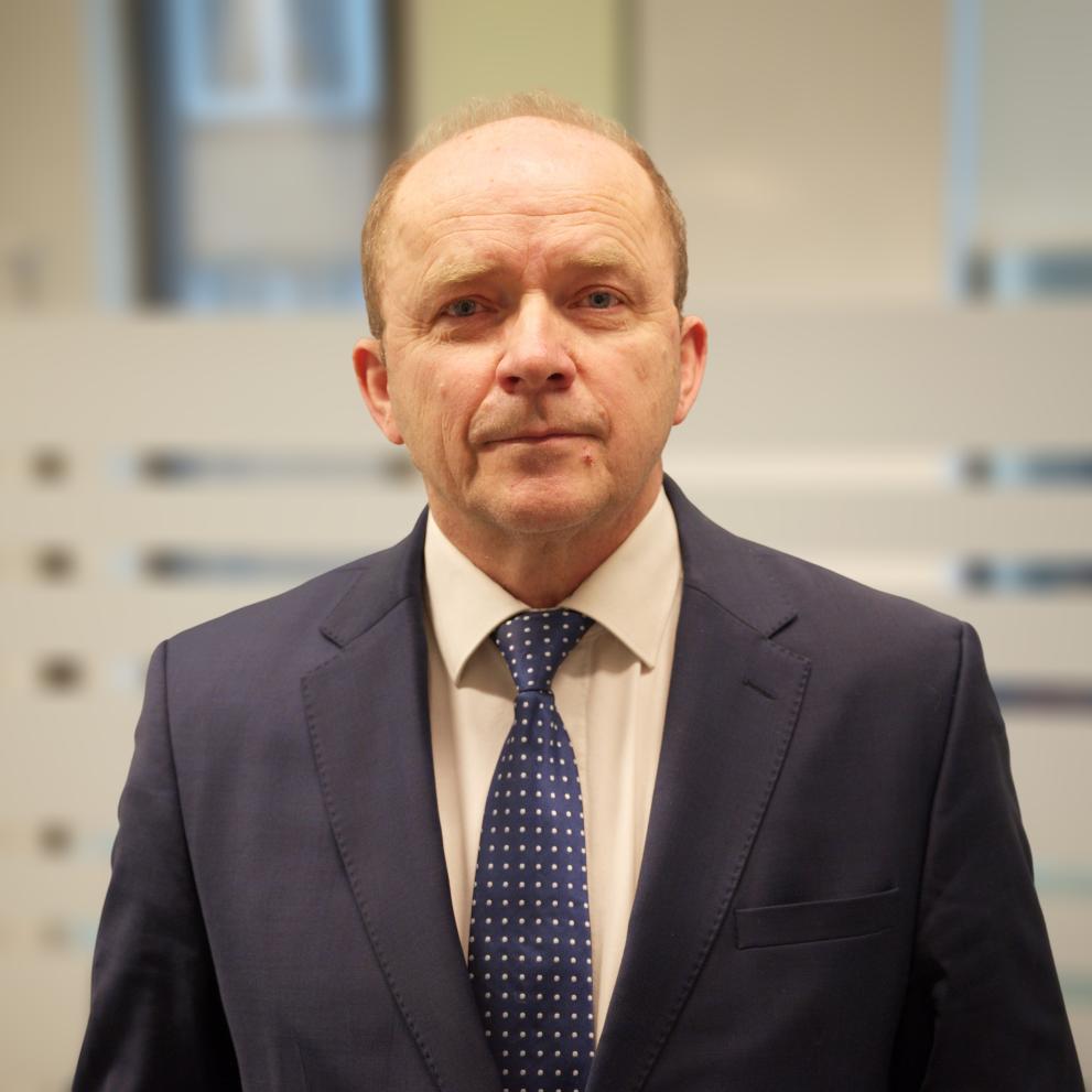 Col Jugoslav Jozić blue suite. Picture focused on his face. Slightly bluerred background